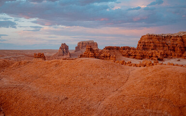 Colorful Sandstone Scenery. Spectacular Sunset Casting Glow On Multilayered Sandstone Formations In Utah