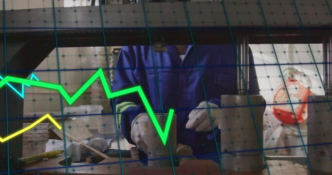 Scooping material into cylinder, tech in blue coverall aligning beneath press and pressing to test