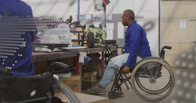 Tech wheeling to shop bench, bracing and standing to fix motor, dotted map text overlaying front