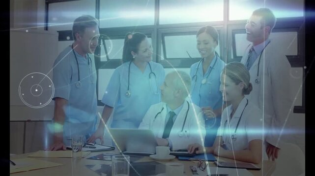 Medical team gathering at table, senior doctor operating laptop, blue overlay growing planning care