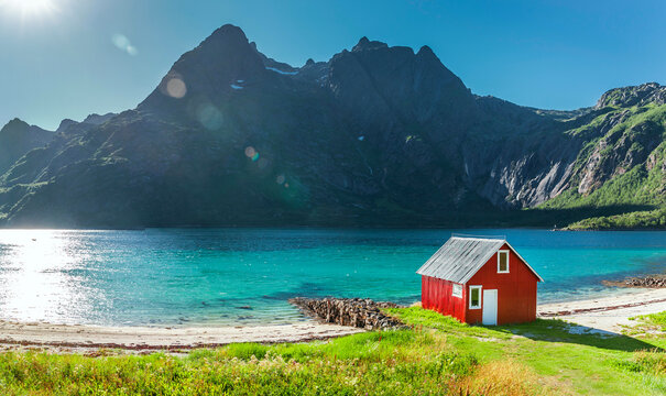 Red boathouse on a fjord in the Lofoten Islands in Norway