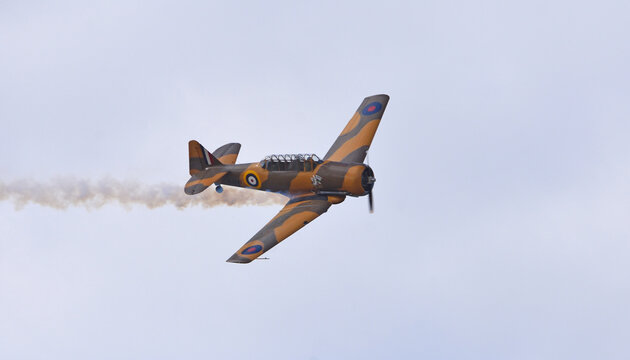 Vintage North American T-6 Harvard aircraft in flight 
