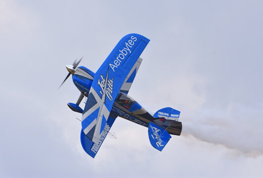 Little Gransden, Cambridgeshire, England - August 24, 2025: Pitts Special stunt plne in flight with smoke