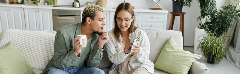 Fototapeta premium Young friends share joyful moments in a cozy apartment with a modern touch