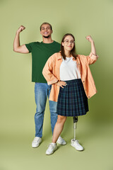 Fototapeta premium Empowering friendship between a young man and a disabled woman in a creative studio