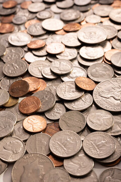 Pile of Golden coin, silver coin, copper coin, quarters, nickels, dimes, pennies, fifty cent piece and dollar coins. Various USA coins, American coins for business, money, financial coins and economy