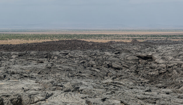Hardened lava field overlooking arid plains in northeastern Ethiopia