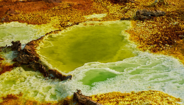 Close-up of acidic sulfur pool and salt crust in Dallol geothermal field, Ethiopia