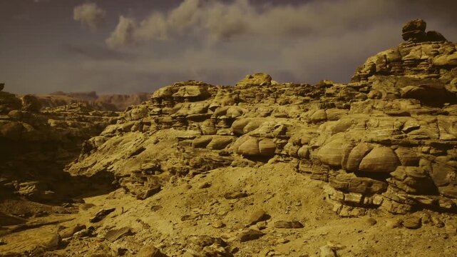 Deserted craggy land beneath foreboding storm clouds looming overhead. Somber and barren mountainous region shrouded in ominous dark clouds and heavy mist