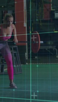 Vertical video: Woman bracing, gripping crate and aligning barbell, teal grid guiding fitness lift