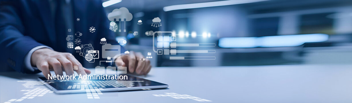 IT administrator holding network dashboard. Network administration manages servers, devices, and connectivity to ensure stable system performance.