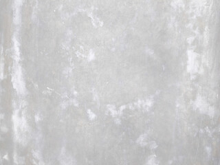 Fototapeta premium Plain gray cement wall texture with white plaster patches and weathered concrete surface, featuring a minimalist industrial background perfect for architectural design or high-quality overlays.