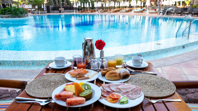 Indulge in a luxury breakfast by the serene poolside in Gran Canaria, Spain