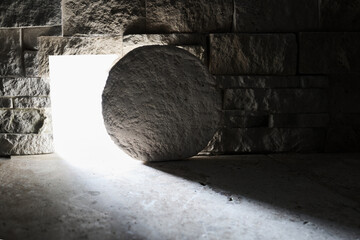 Empty tomb with stone rolled away and bright light