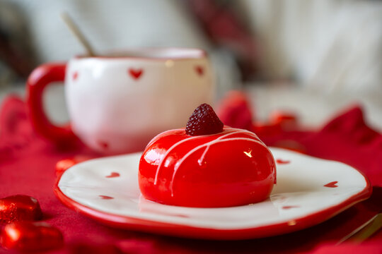 Valentine's Day on the table: strawberry cake, rose-shaped pancake cake and heart-shaped cake.
