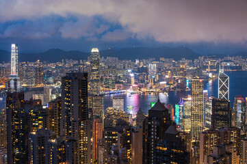 Obraz premium View of Hong Kong and Kowloon from Victoria peak. Evening, sunset. Panorama of Hong Kong, skyscrapers and nature. 21 May 2025, Hong Kong, China