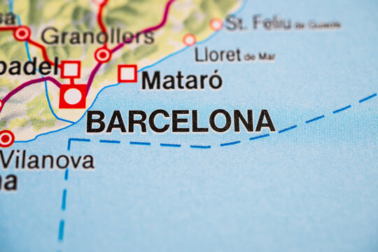 Barcelona and surrounding coastal cities on Spain atlas close up.