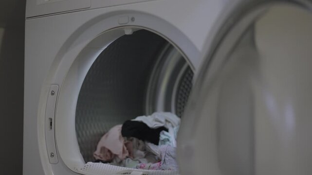Wet laundry is placed in the dryer