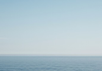 Obraz premium Minimalist abstract background showing a pristine, empty horizon line separating the ocean and the expansive pale blue sky, backdrop, blank, minimal