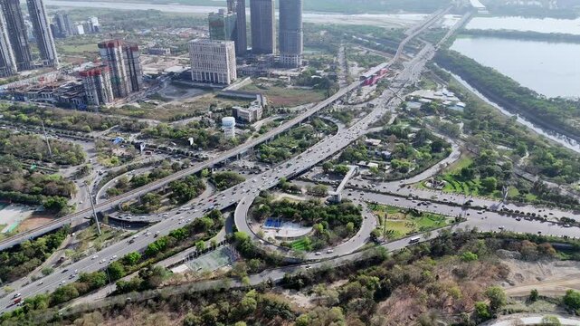 Aerial hyper lapse view of Noida Agra Highway round circle flyover at Okhla bird sanctuary in Noida, Uttar Pradesh
