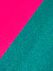 Fototapeta premium Abstract geometric pattern on a pink and green carpet