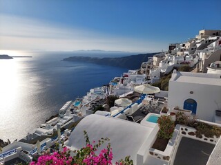 Fototapeta premium Whitewashed houses with terraces and pools and a beautiful view in Imerovigli on Santorini island, Greece