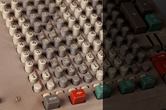 Vintage calculator keypad with numeric buttons and retro control panel, electronic device detail with copy space on right side for text design -Serie VE05