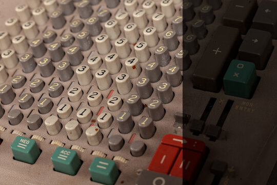 Vintage calculator keypad with numeric buttons and retro electronic device detail, copy space on right side for text or advertising design -Serie VE05