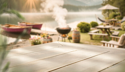 Empty wooden table outdoors with blurred garden background – summer vacation and relaxation product mockup. Natural landscape and peaceful and relaxing atmosphere. Vacation time.