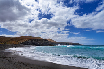 Rock formations and caves on the Atlantic Ocean coast in Ajuy, Fuerteventura, wallpaper or background for your project © anettastar