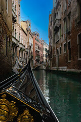 Canal with bridge in Venice, Italy, from the gondola © Ervin