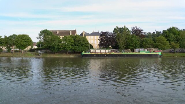 Calm waters of the Oise river in Creil, Oise department, France

