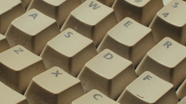 Man working and gaming on retro computer PC, IT engineer with vintage computer at home, using old fashion technology, close up of retro setup. 