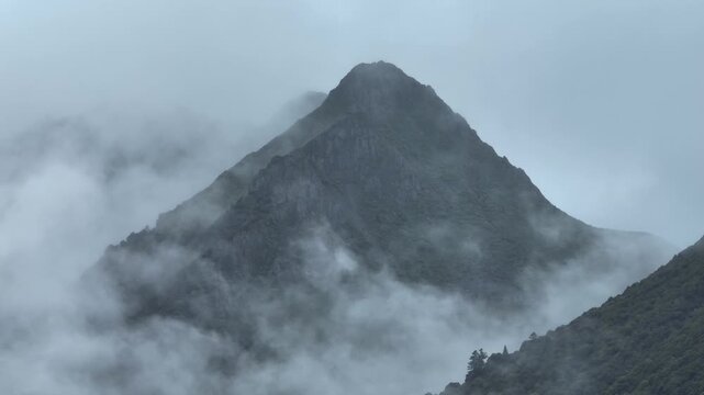 Aerial footage of beautiful high altitude snowcapped mountains landscape