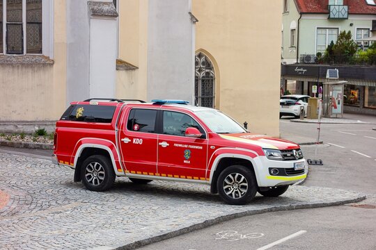 Red Volkswagen Amarok pickup car of fire brigade in Melk, Austria on street