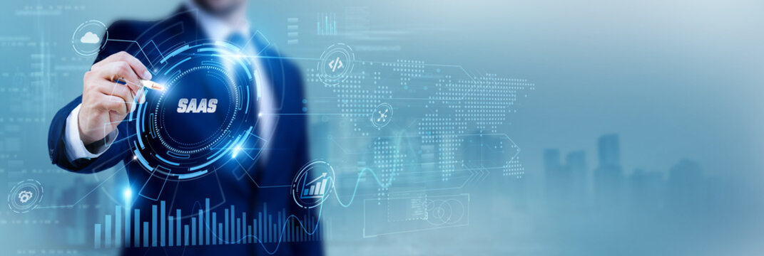 Developer using a pen while analyzing data SaaS Software as a Service and cloud applications, subscription platforms, digital solutions, enterprise software, scalable technology, IT innovation