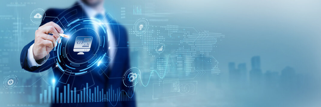 Software developer using a pen while analyzing data Software Development and application design, coding projects, programming solutions, agile development, IT innovation, software engineering