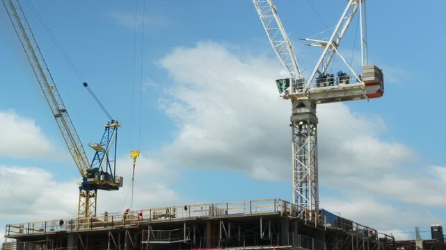 Two construction cranes. Time lapse. Toronto. No visible logos. HD.