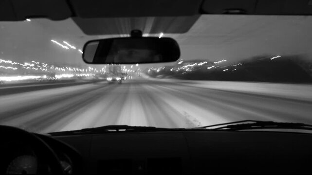 Winter POV driving. Toronto highway 401 time lapse. No visible logos. Black & white. HD video. 