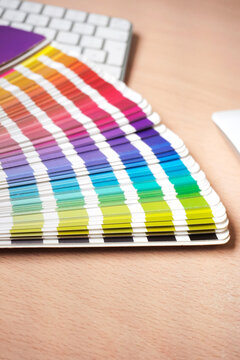Graphic designer color chart with keyboard and mouse