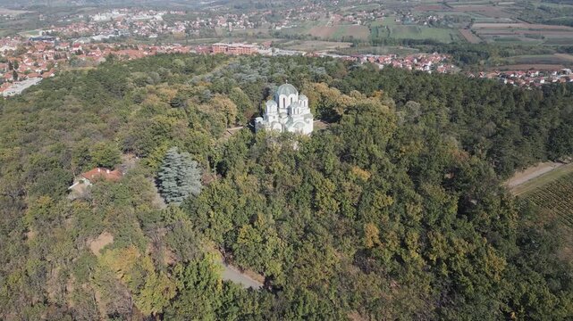 Drone flying forwards above the Oplenac hill, a historic location in Sumadija, cental Serbia. Panoramic view.