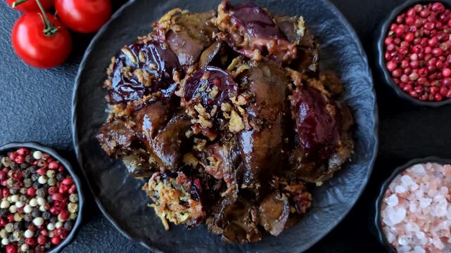 Chicken, duck, or goose liver with plums, onions, and spices. Chicken liver as a food background for your design