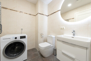 Fototapeta premium Modern Compact Kitchen in a Minimalist Apartment Interior With Wooden Floor