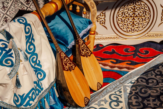 Artisanal Musical Instruments Adorned With Intricate Embroidery And Fabric Accents