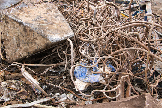 Steel waste from rebar close-up, scrap steel and other metal waste, preparation for recycling