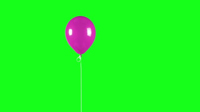 A glossy pink balloon tied with a white string floats steadily against a solid chroma key green background. This footage is designed for easy compositing and color keying in video production.