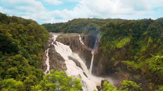 Barron Falls Waterfall Cascading into Barron Gorge National Park near Kuranda, Cairns, Queensland, Australia. Majestic Tropical Rainforest Landscape with Flowing Water and Mist.