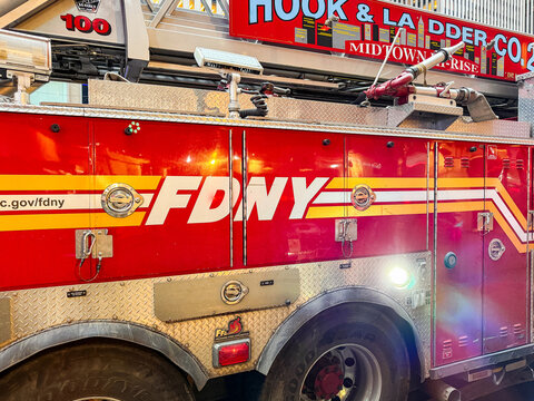 New York, USA - 9 January 2026:  Side view of a FDNY New York Fire department hi-rise ladder truck stopped on a street in midtown Manhattan
