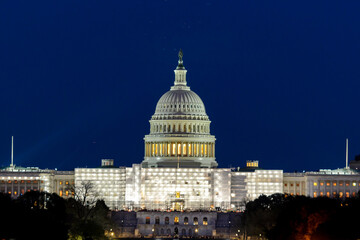 Fototapeta premium The United States Capitol with scaffolding at night