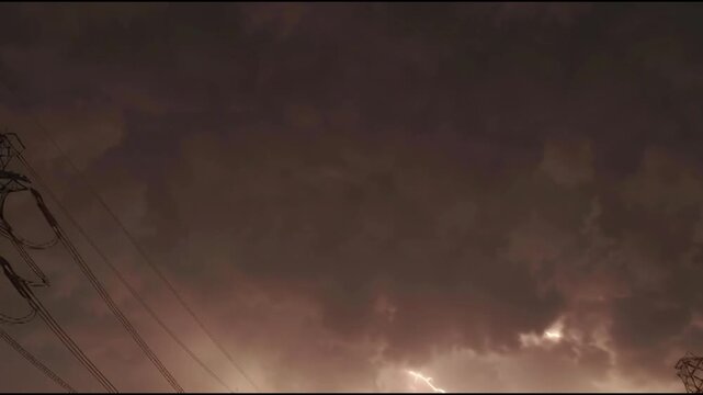 Dramatic sky with lightning strikes illuminating dark storm clouds overhead, hinting at a powerful natural phenomenon occurring